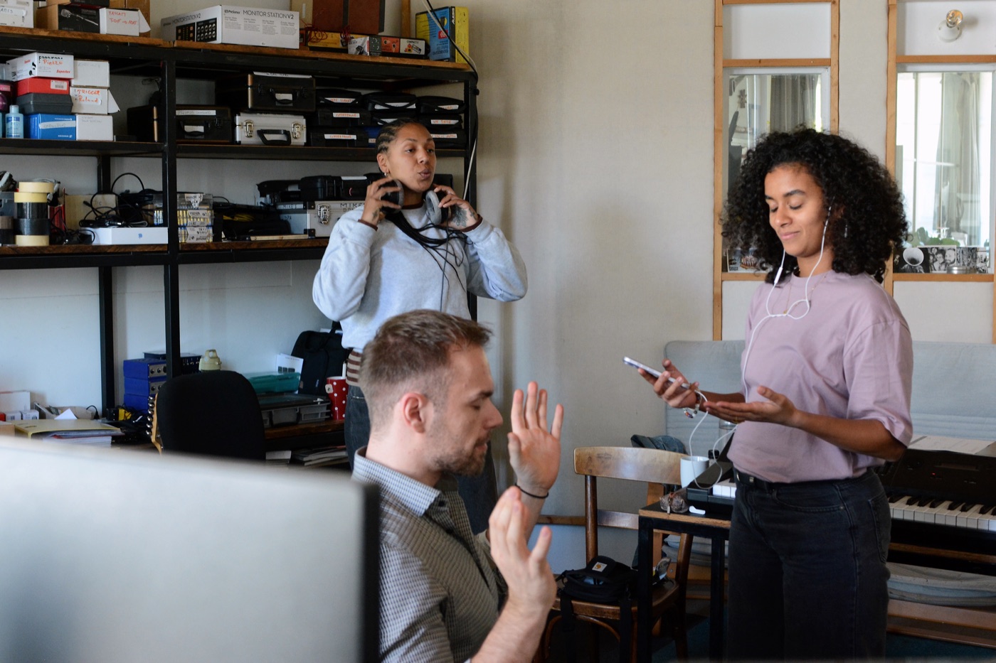 Marc working with two collaborators during a studio session
